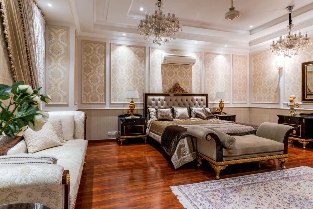 Luxury king size bed with upholstered headboard in a grand bedroom